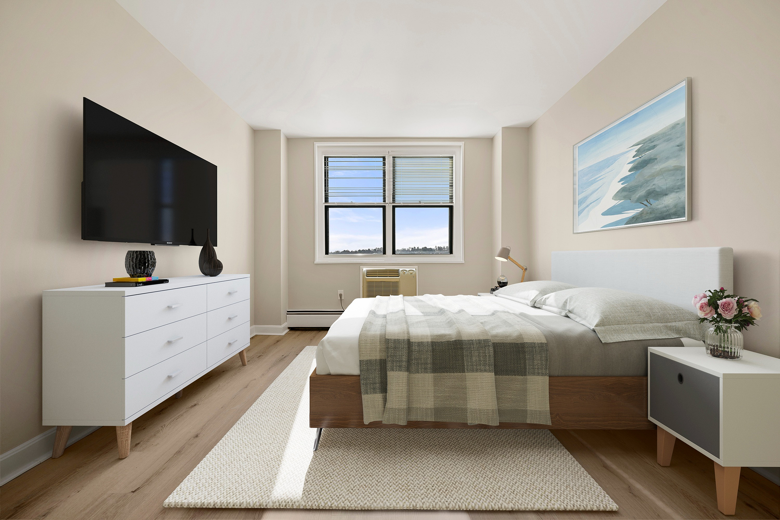 Bright, modern bedroom with natural light from a large window, featuring a stylish bed with a checkered duvet, sleek dresser, wall-mounted TV, and elegant decor.