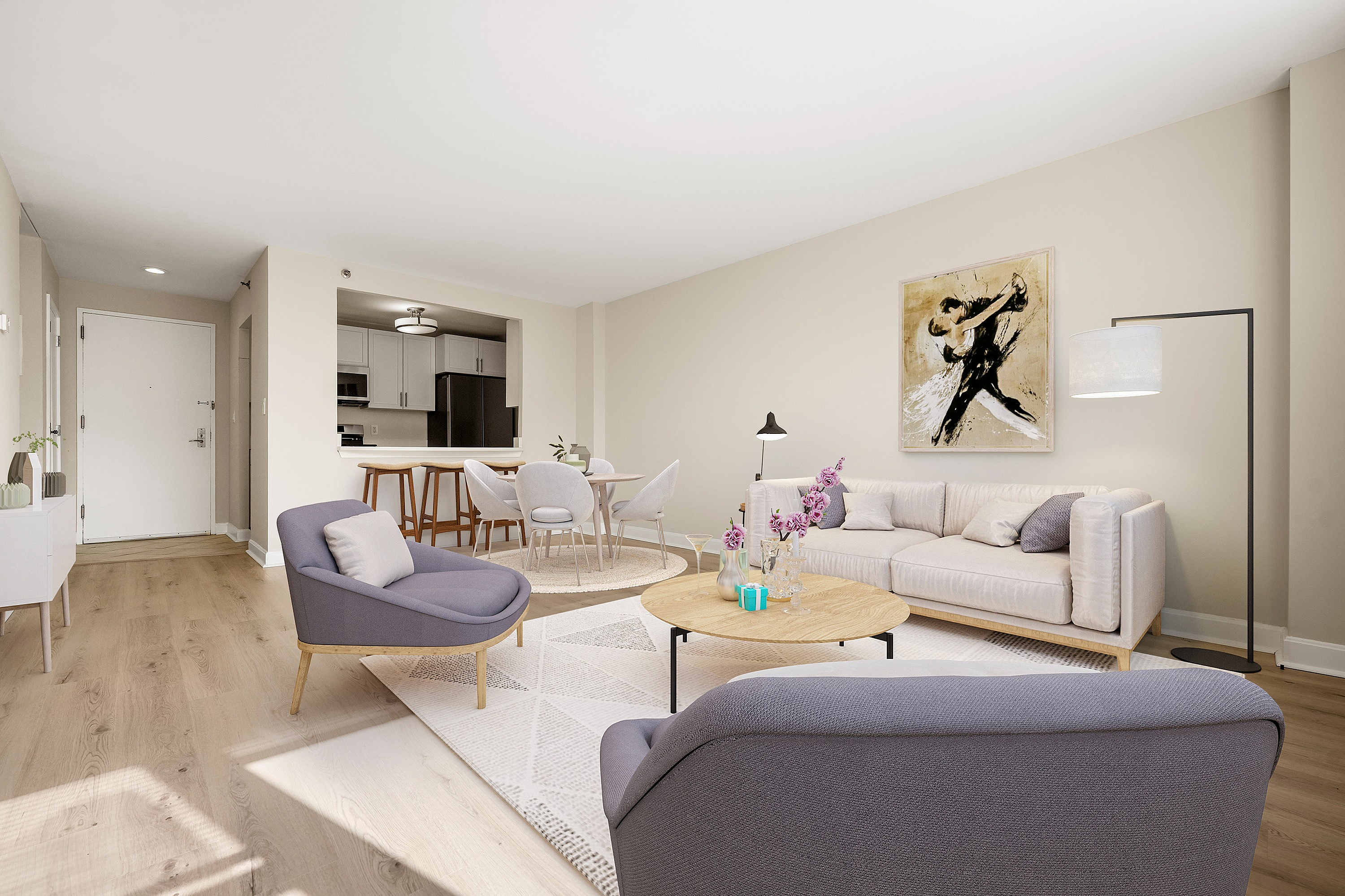 Elegant open-plan living room with modern furniture, bright natural light, and stylish dining area adjacent to a sleek kitchen.