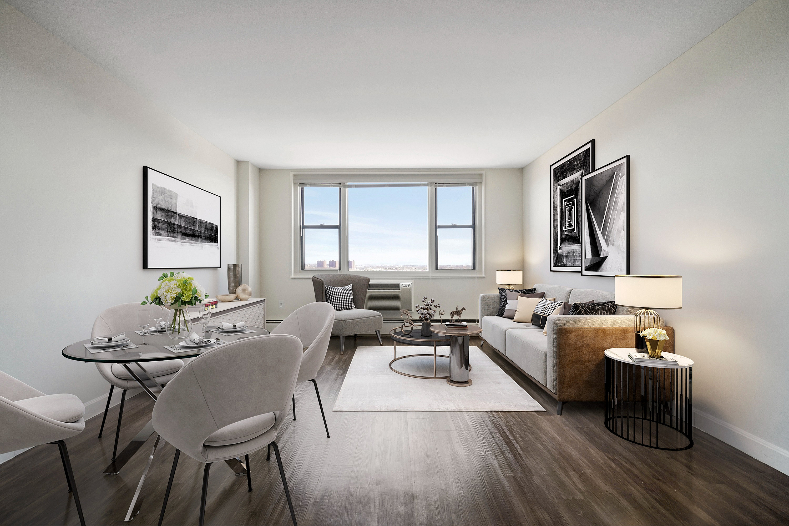 Modern and inviting living and dining area with sleek furniture, stylish decor, and large window offering breathtaking views.