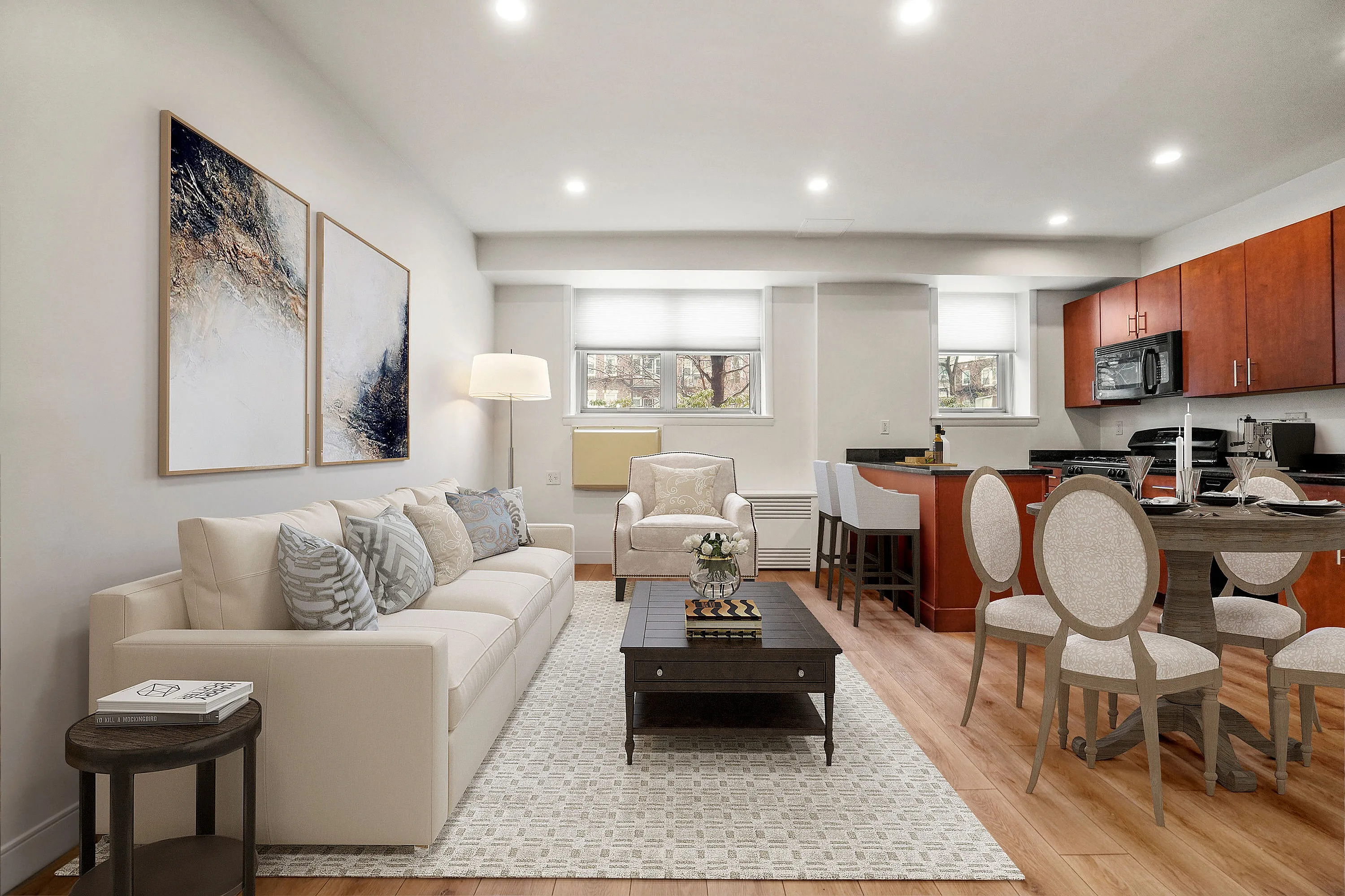 Sophisticated open-plan living room blending modern decor with a cozy kitchen and dining area, featuring elegant furnishing and warm lighting.