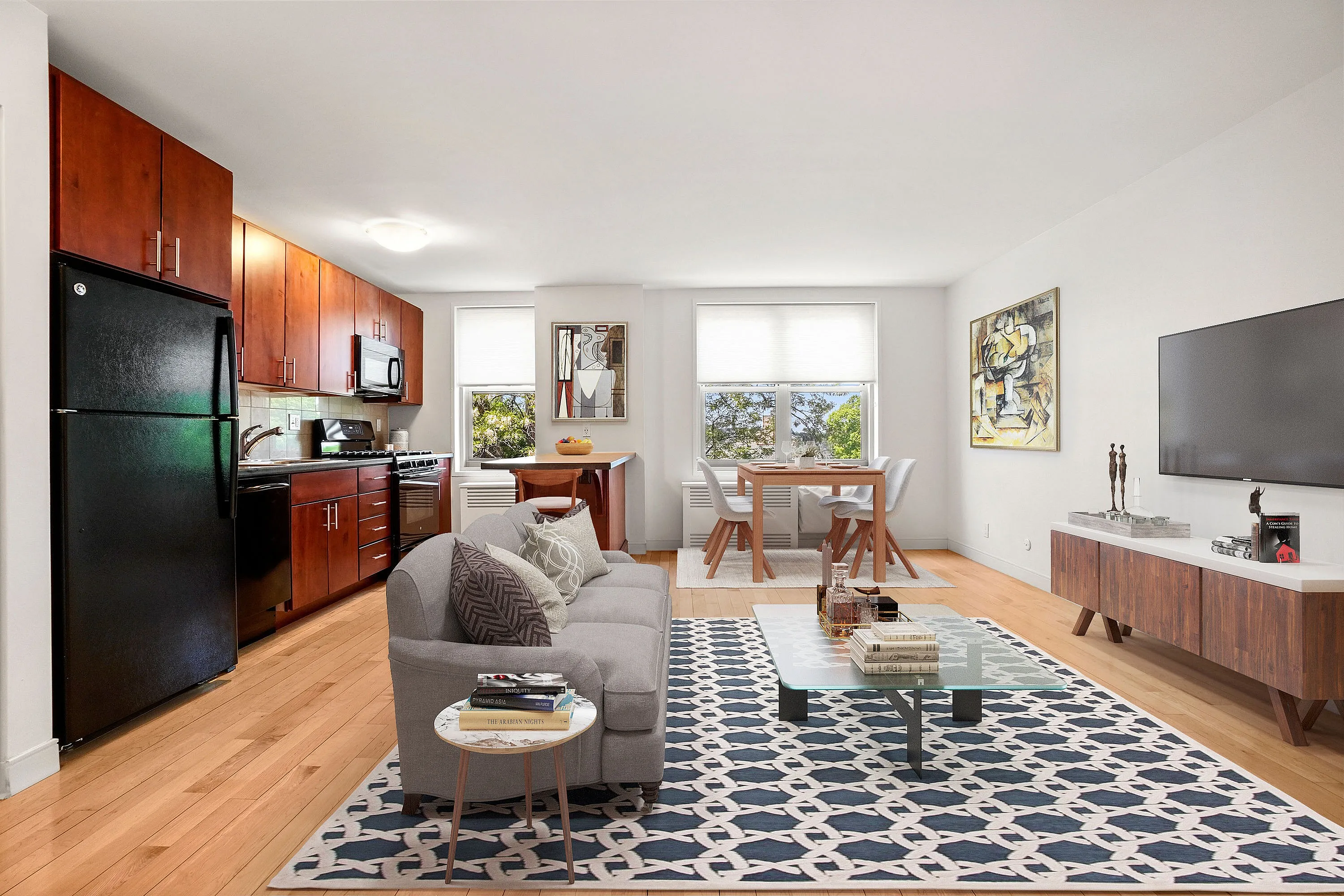 Inviting open-plan apartment with a modern kitchen, cozy living room, and elegant dining area, featuring stylish wood cabinetry and sleek decor.
