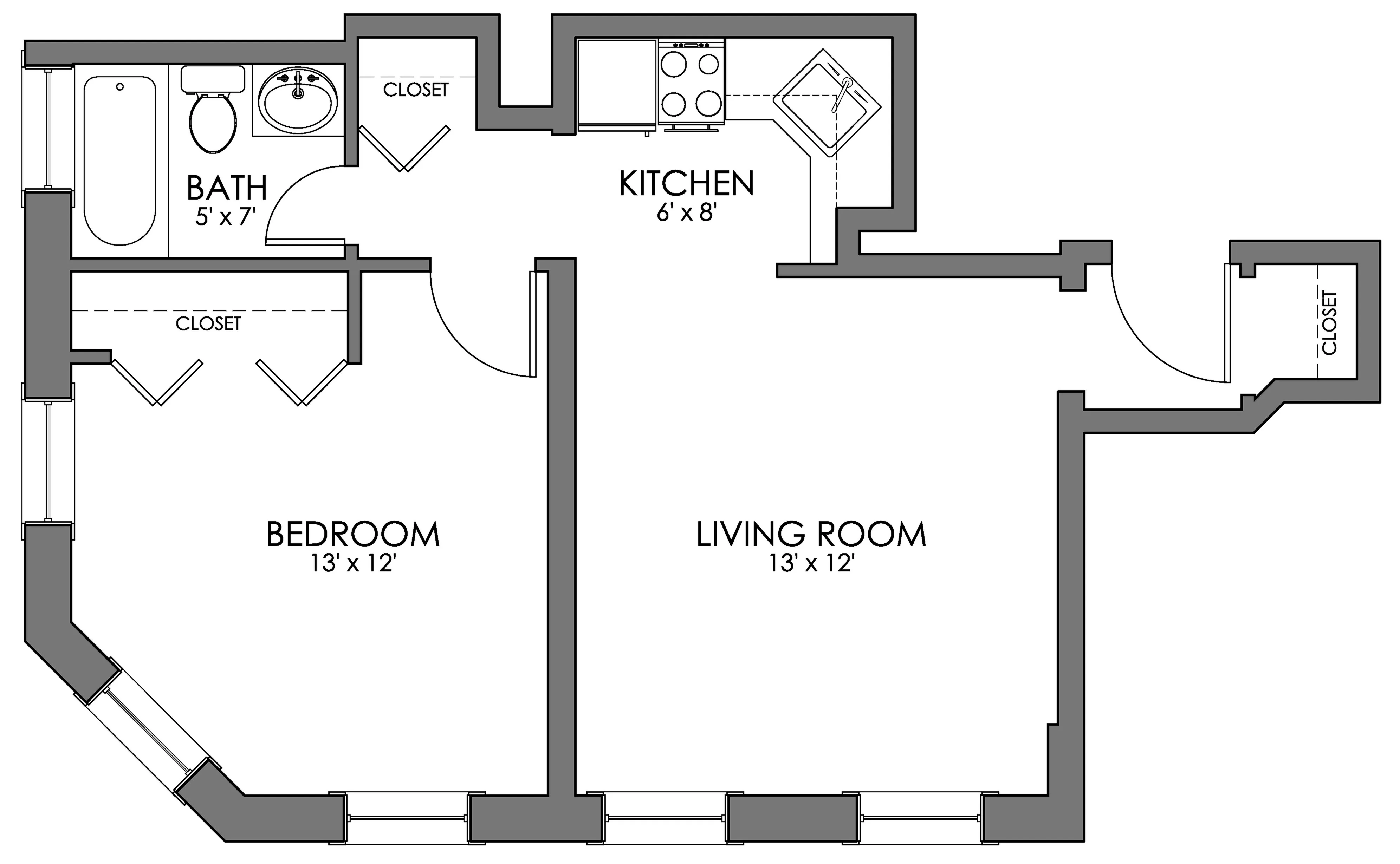 Chic floor plan showcasing a spacious bedroom, open living room, modern kitchen, and a well-appointed bathroom with ample closet space.