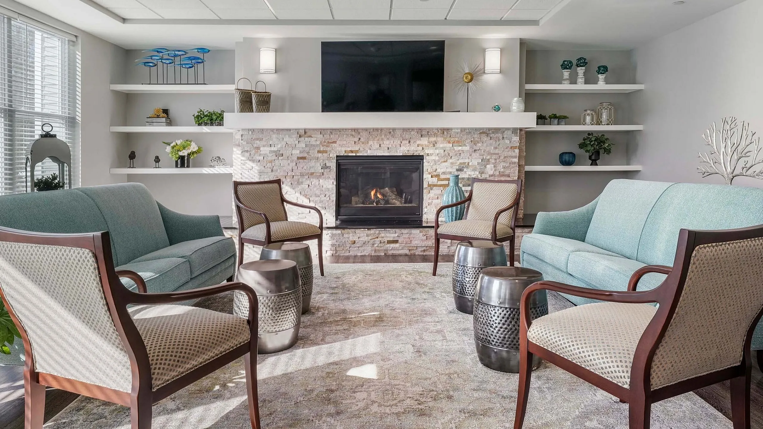 Inviting clubroom with cozy fireplace, modern decor, and elegant seating area, perfect for relaxation and gatherings.