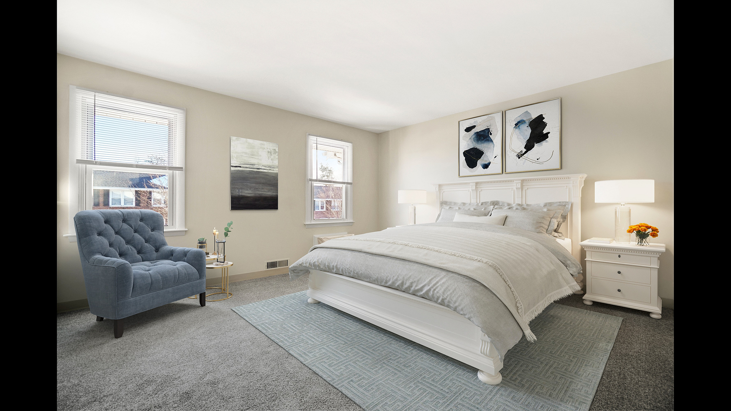 Bright and elegant bedroom featuring a plush bed with cozy linens, stylish artwork, and soft natural light streaming through multiple windows.