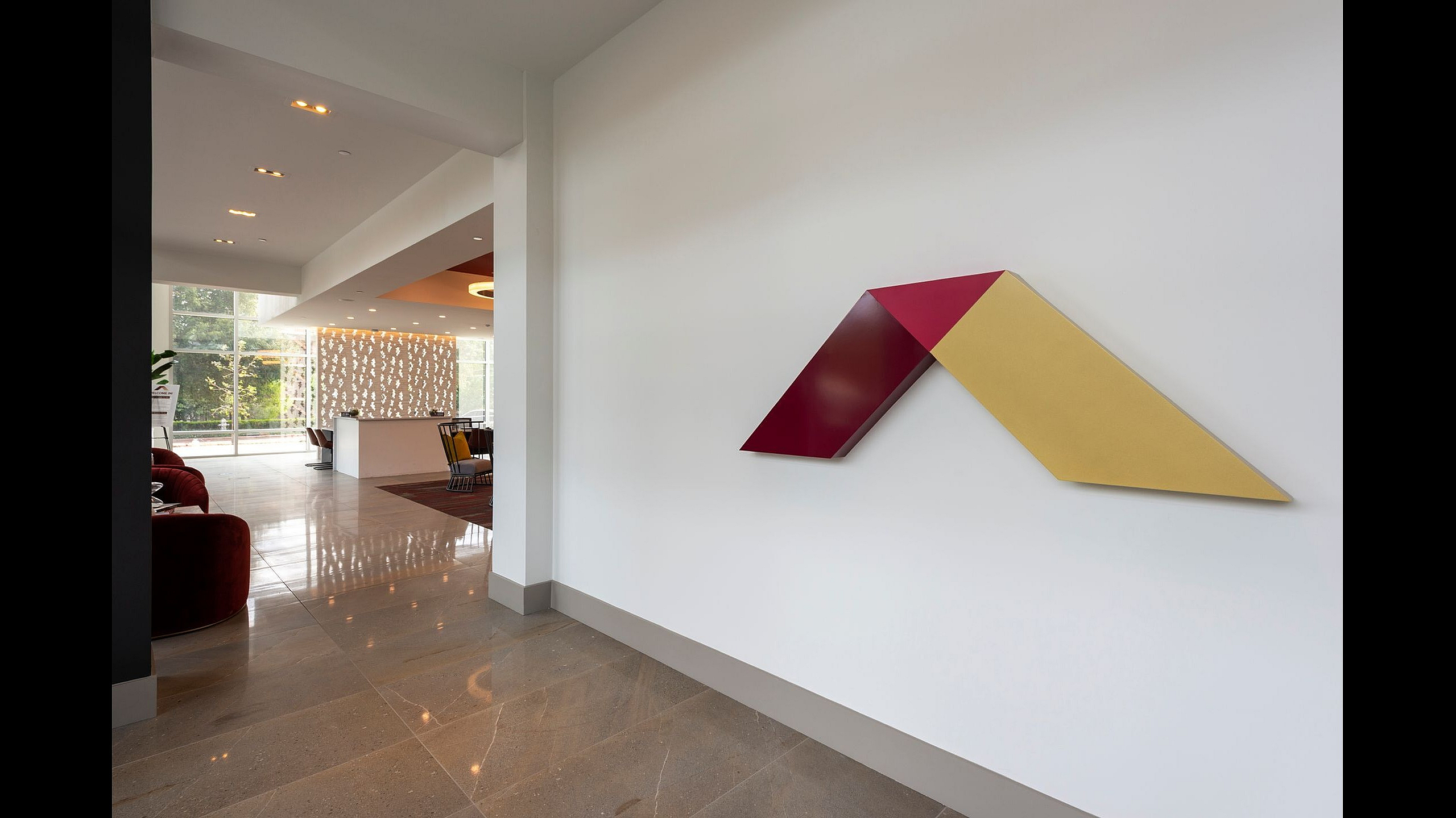 Modern and inviting apartment lobby with sleek decor, comfortable seating, and large windows for abundant natural light.