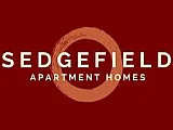 Sedgefield logo on a lush green background, evoking a sense of tranquility and community living.