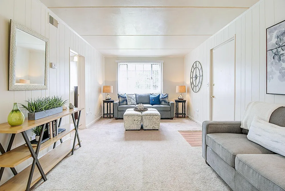 Inviting living room with stylish decor, plush seating, and abundant natural light, perfect for relaxation and entertaining.