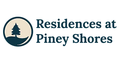 Residences at Piney Shores logo featuring a serene pine tree silhouette in a circle.