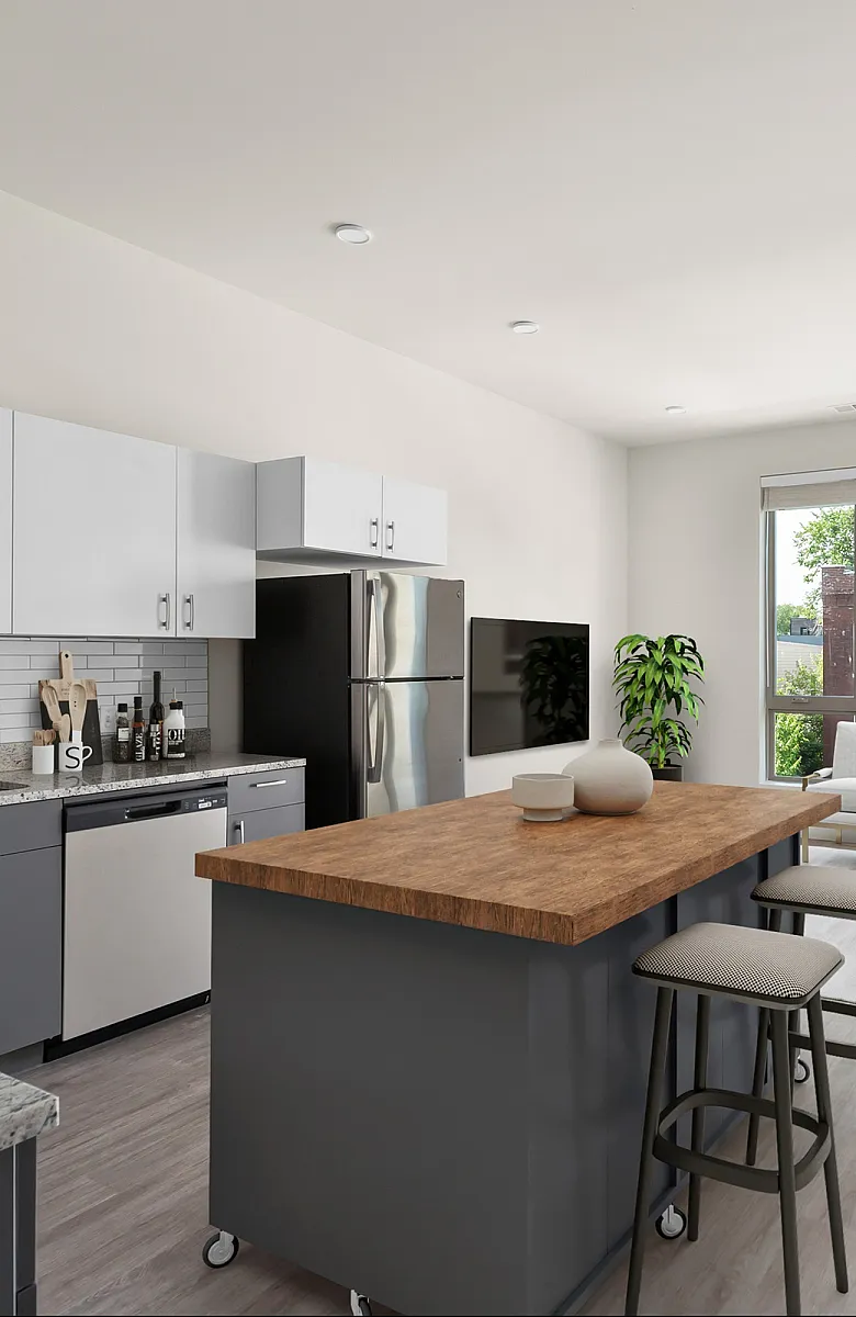 Modern open-plan kitchen and living room with sleek cabinetry, granite countertops, and large sunlit windows overlooking a vibrant neighborhood.