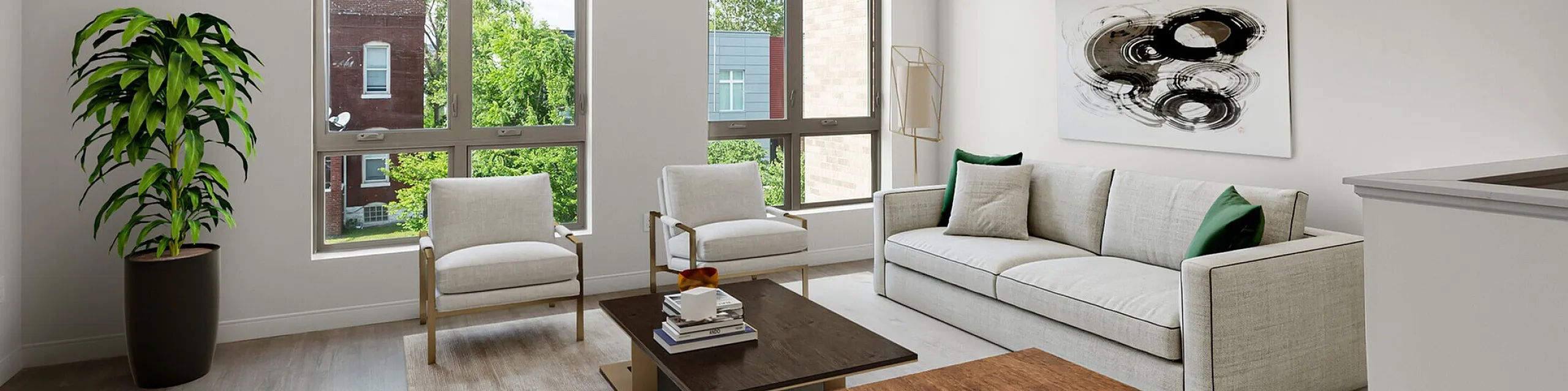 Bright and modern living room with large windows, sleek furniture, and contemporary artwork, offering a stylish and inviting ambiance.