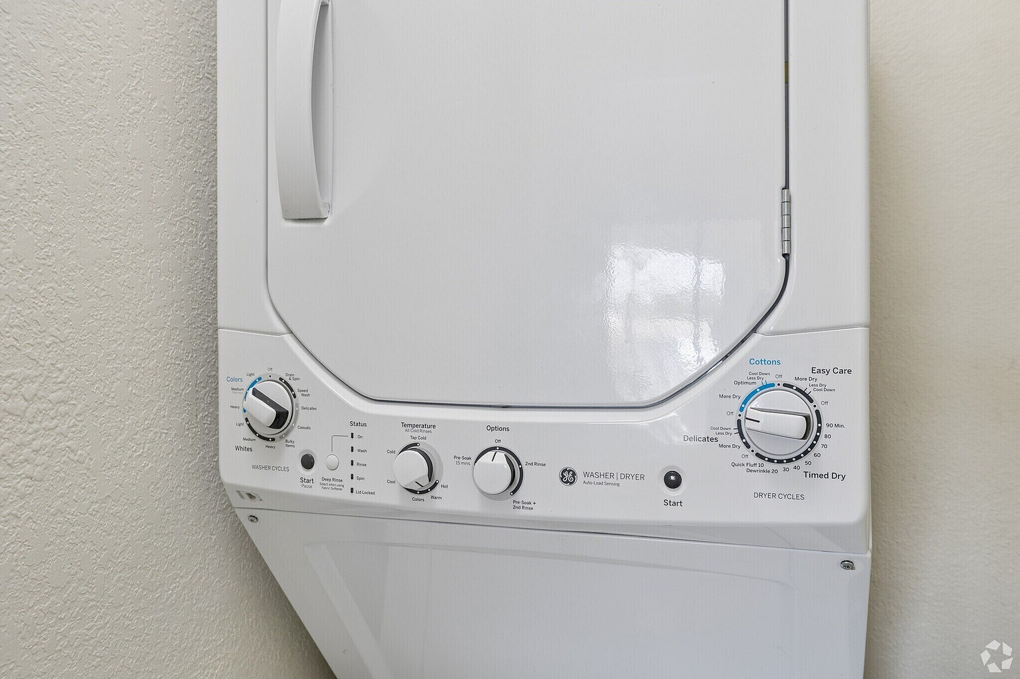 Space-saving washer and dryer unit with user-friendly controls, perfect for efficient apartment living.