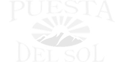 Elegant Puesta del Sol luxury apartment logo in a sleek white design.