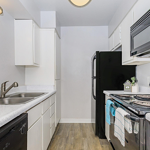 Chic modern kitchen with sleek appliances, stylish cabinetry, and elegant countertops, perfect for culinary enthusiasts.
