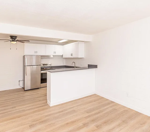Bright kitchen with modern appliances and hardwood floors at Miramonte on 3rd, Tucson AZ