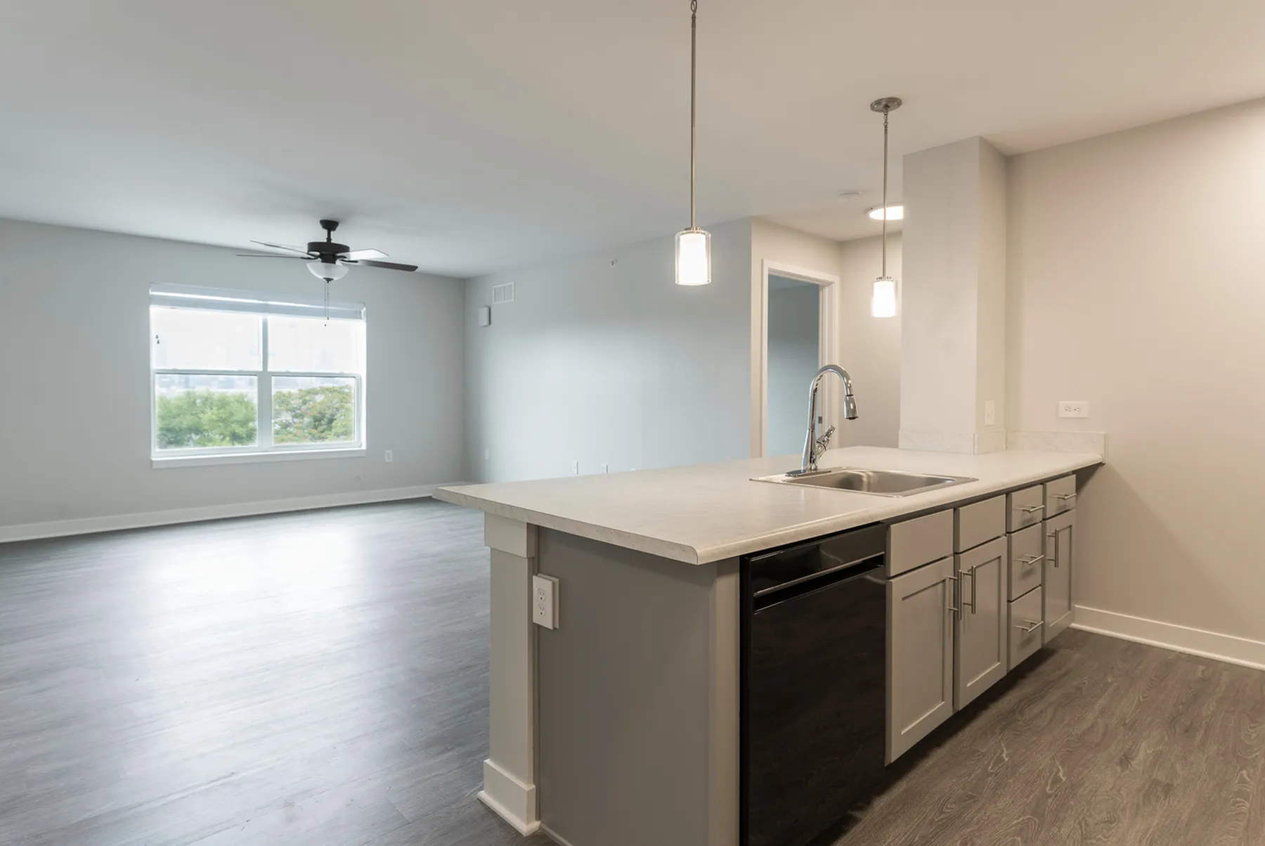 Apartment Featuring a modern kitchen and wood plank flooring