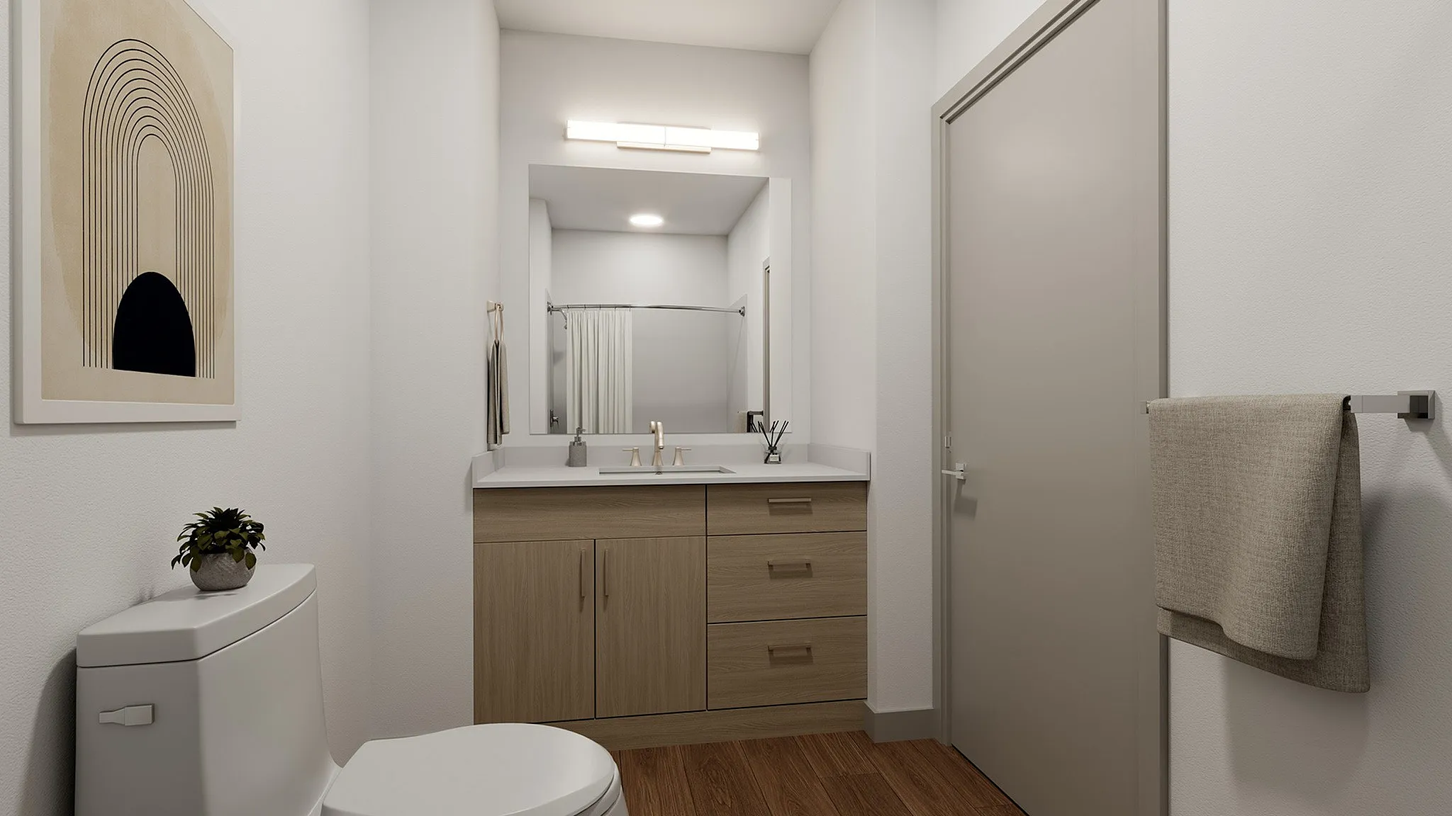 Elegant bathroom featuring modern fixtures, a spacious vanity with sleek wood cabinets, and stylish wall art.