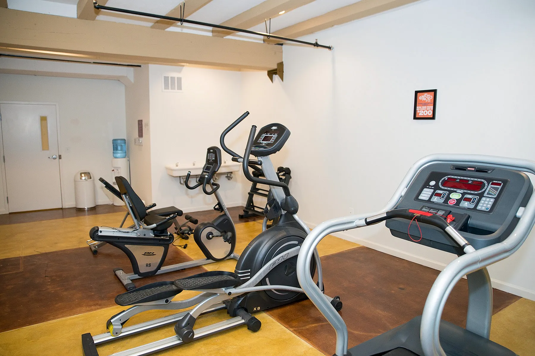 Well-equipped fitness room with state-of-the-art exercise machines, perfect for a healthy lifestyle and workout convenience.