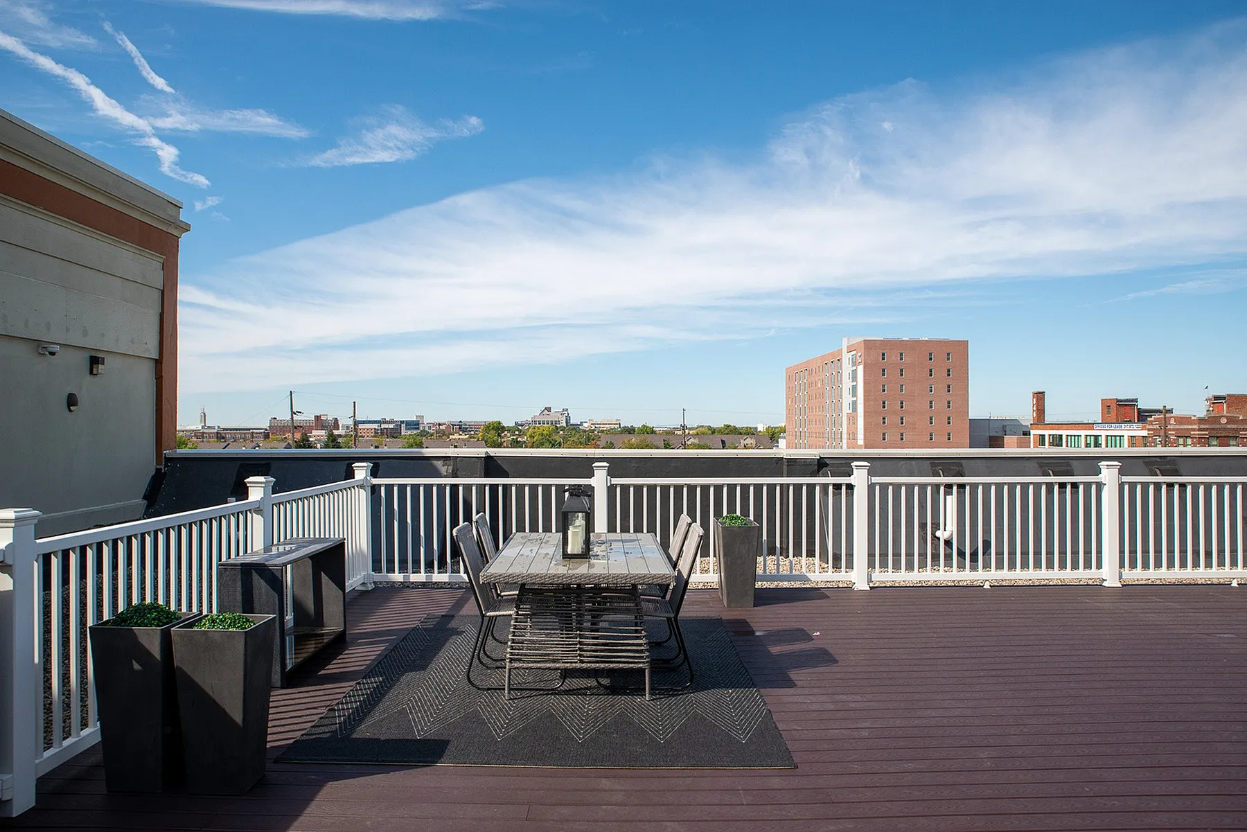 Spacious rooftop terrace with stylish seating, offering stunning city views and a perfect outdoor escape.