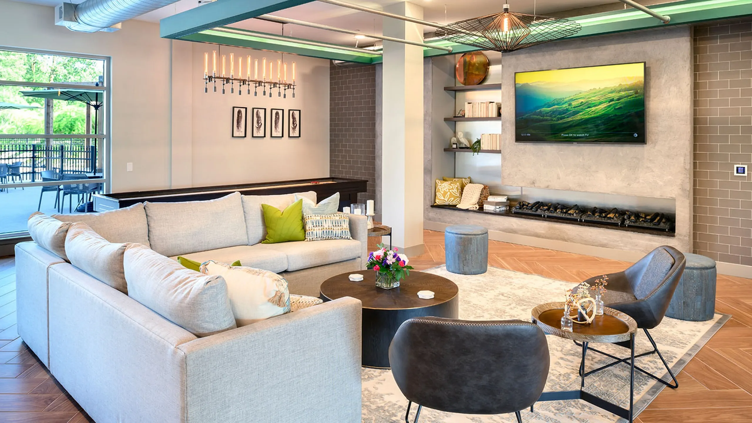 Modern and inviting living area with a plush sectional sofa, chic decor, and a contemporary fireplace, perfect for relaxing and entertaining.