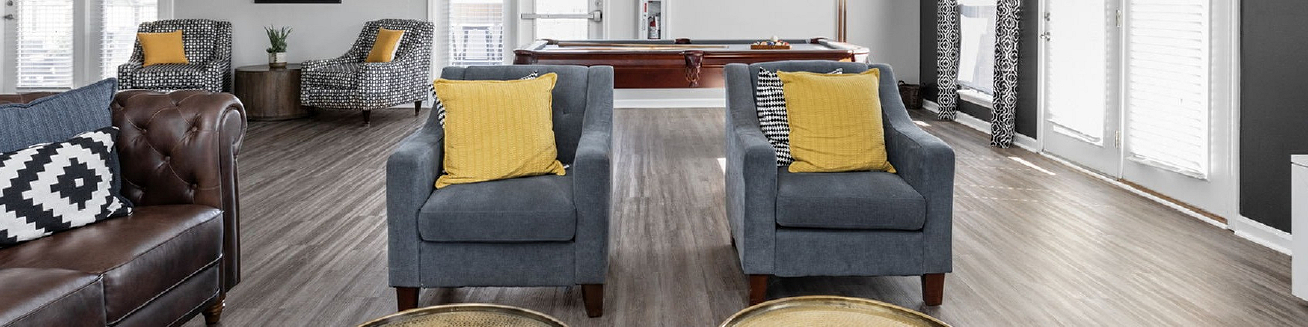 Chic and spacious living area with contemporary decor, featuring comfortable seating, elegant lighting, and stylish accents ideal for relaxation and entertainment.
