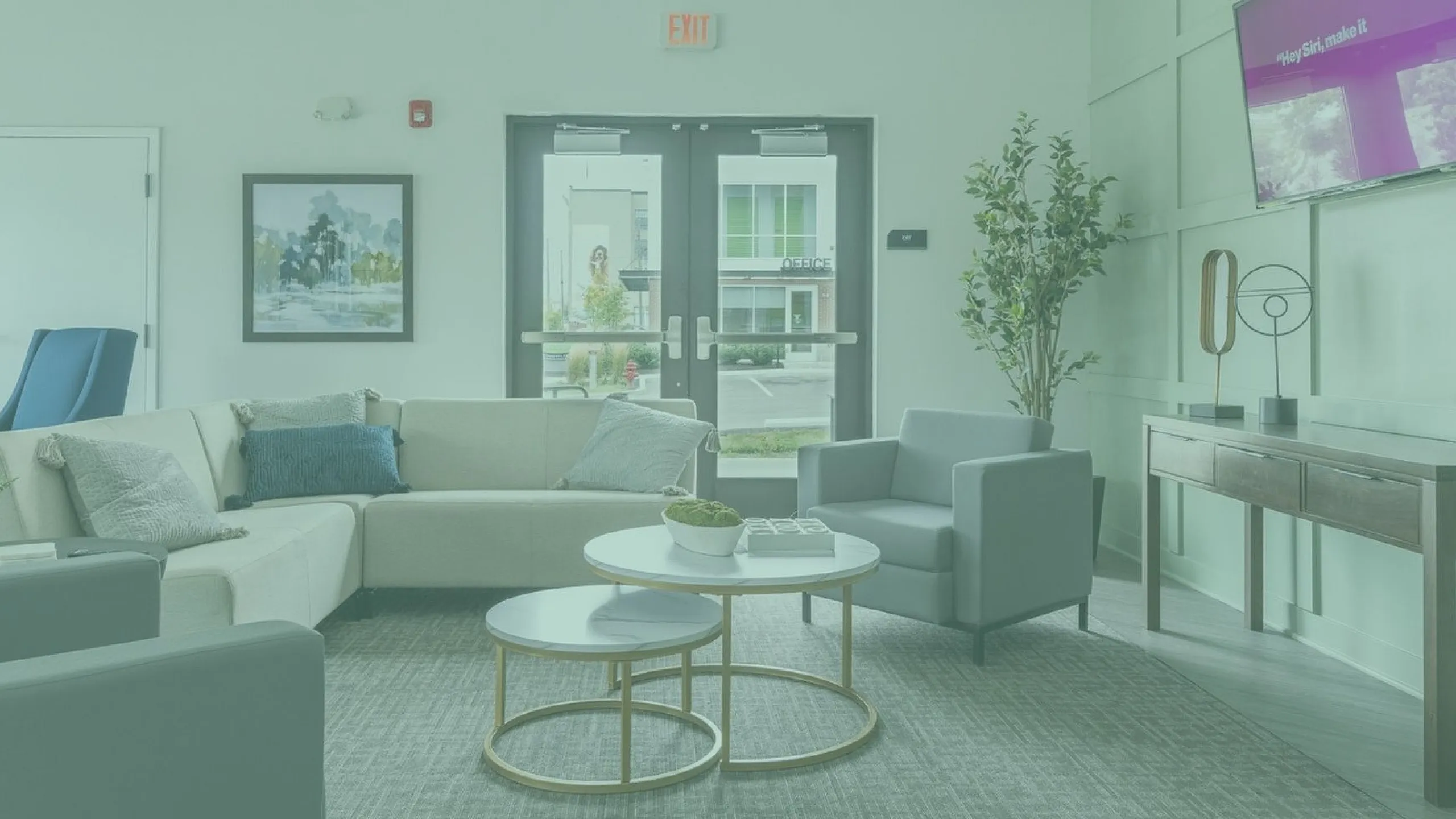 Inviting apartment lounge featuring a modern sofa set, stylish coffee tables, and a chic decor, perfect for relaxation and socializing.