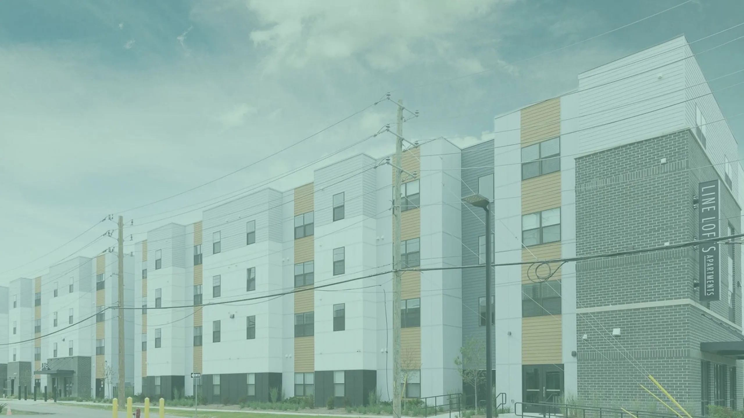 Modern apartment building with sleek architecture and vibrant colors, offering comfortable urban living.