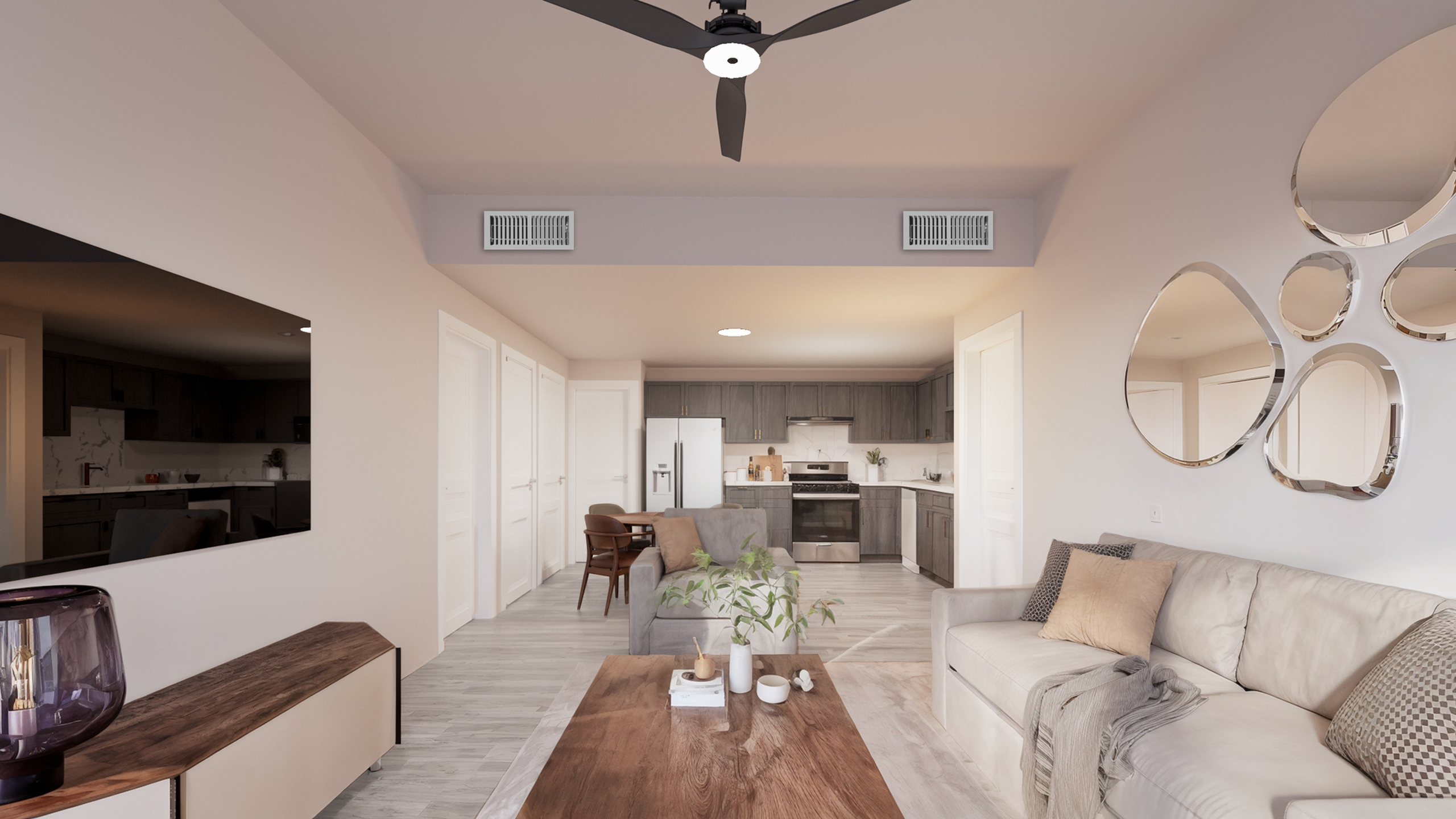 Elegant open-plan living room with cozy neutral tones, stylish furniture, and contemporary kitchen featuring modern appliances.