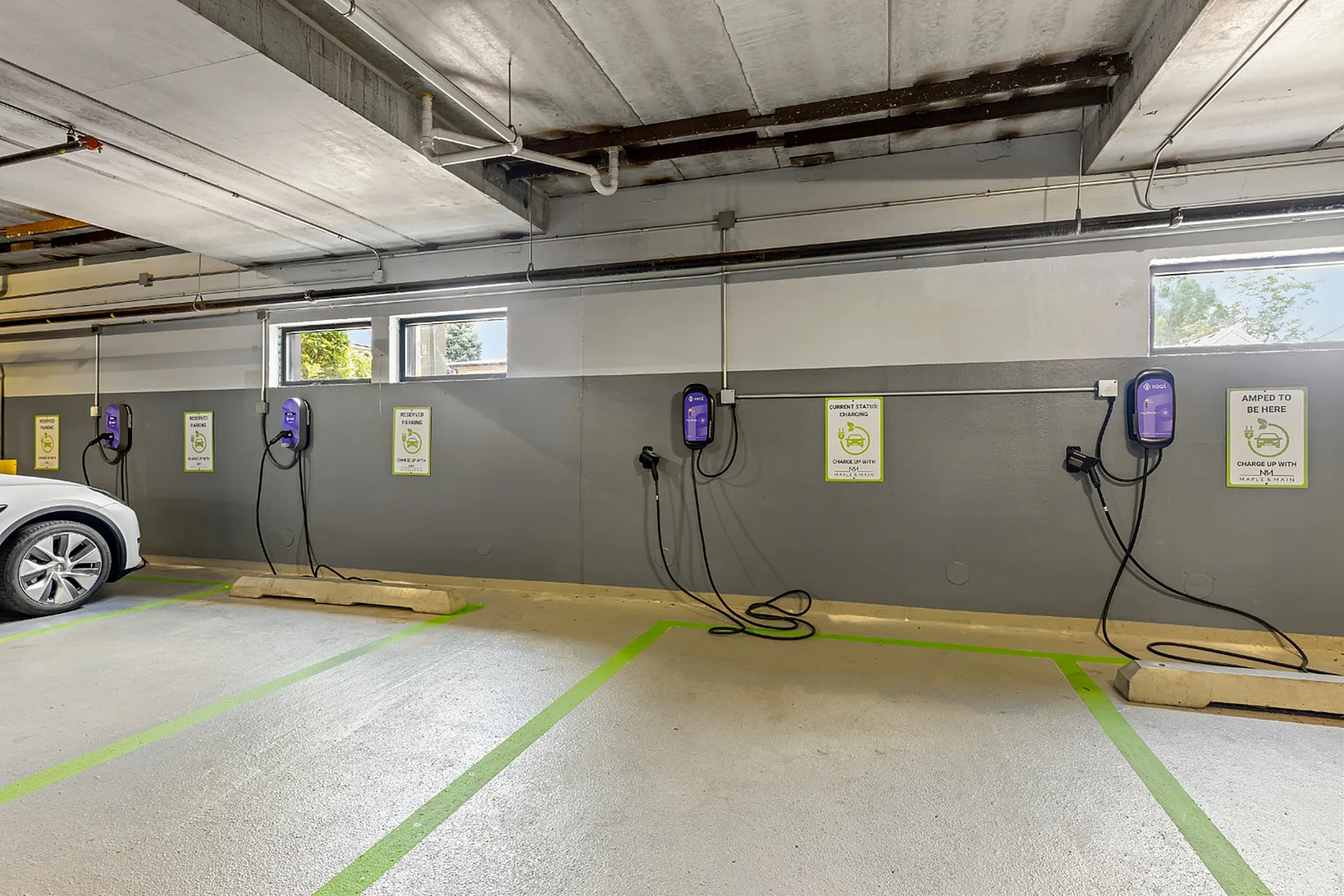 Modern parking garage with dedicated electric vehicle charging stations, offering convenience and eco-friendly amenities.