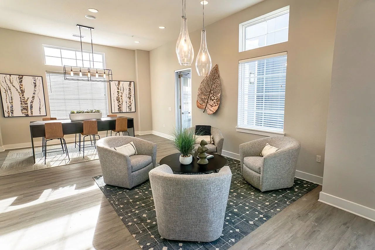 Bright and modern living space with elegant lighting, cozy seating, and chic decor, perfect for stylish gatherings.