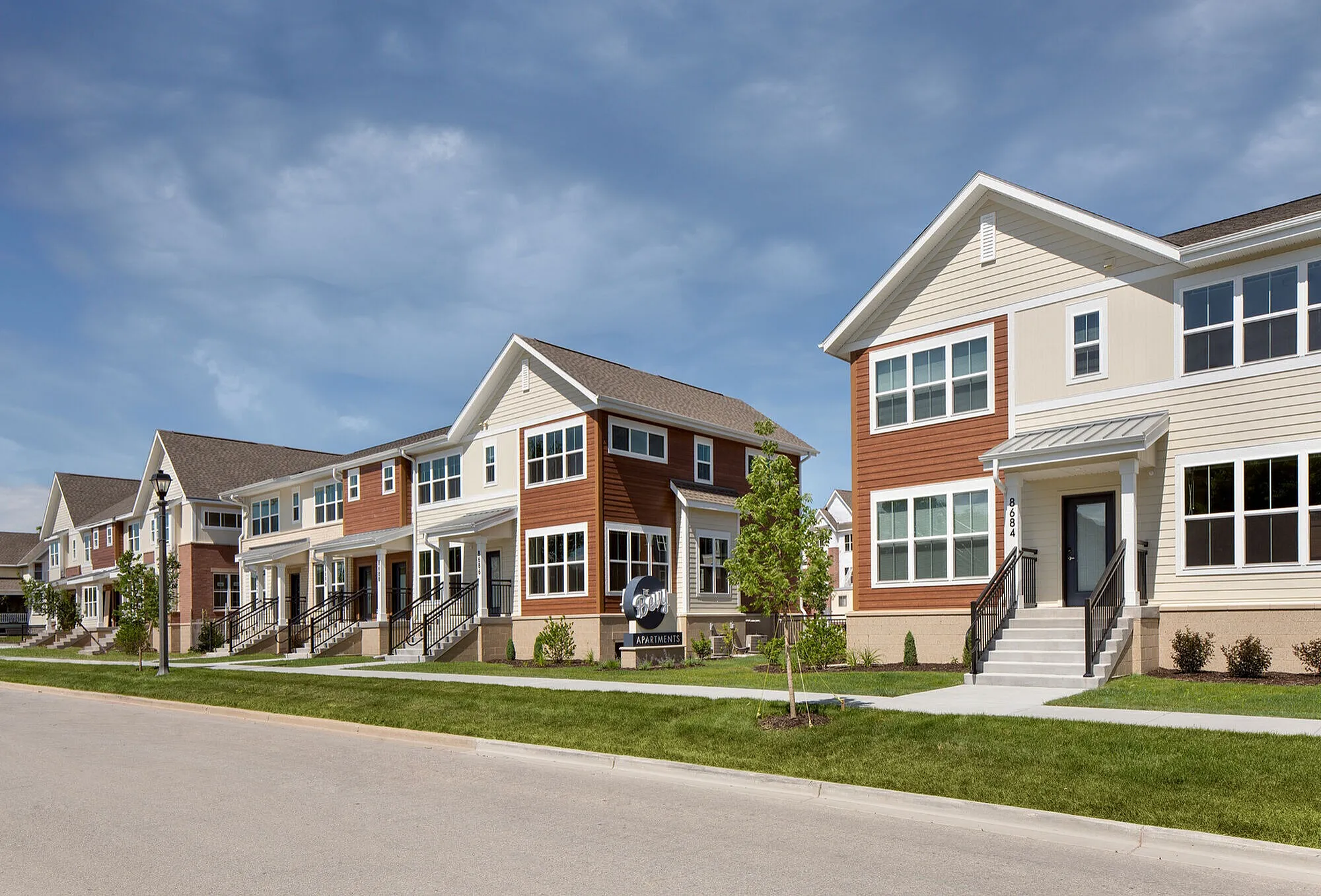 Charming suburban apartments showcasing modern architecture with vibrant exteriors and well-maintained landscaping.