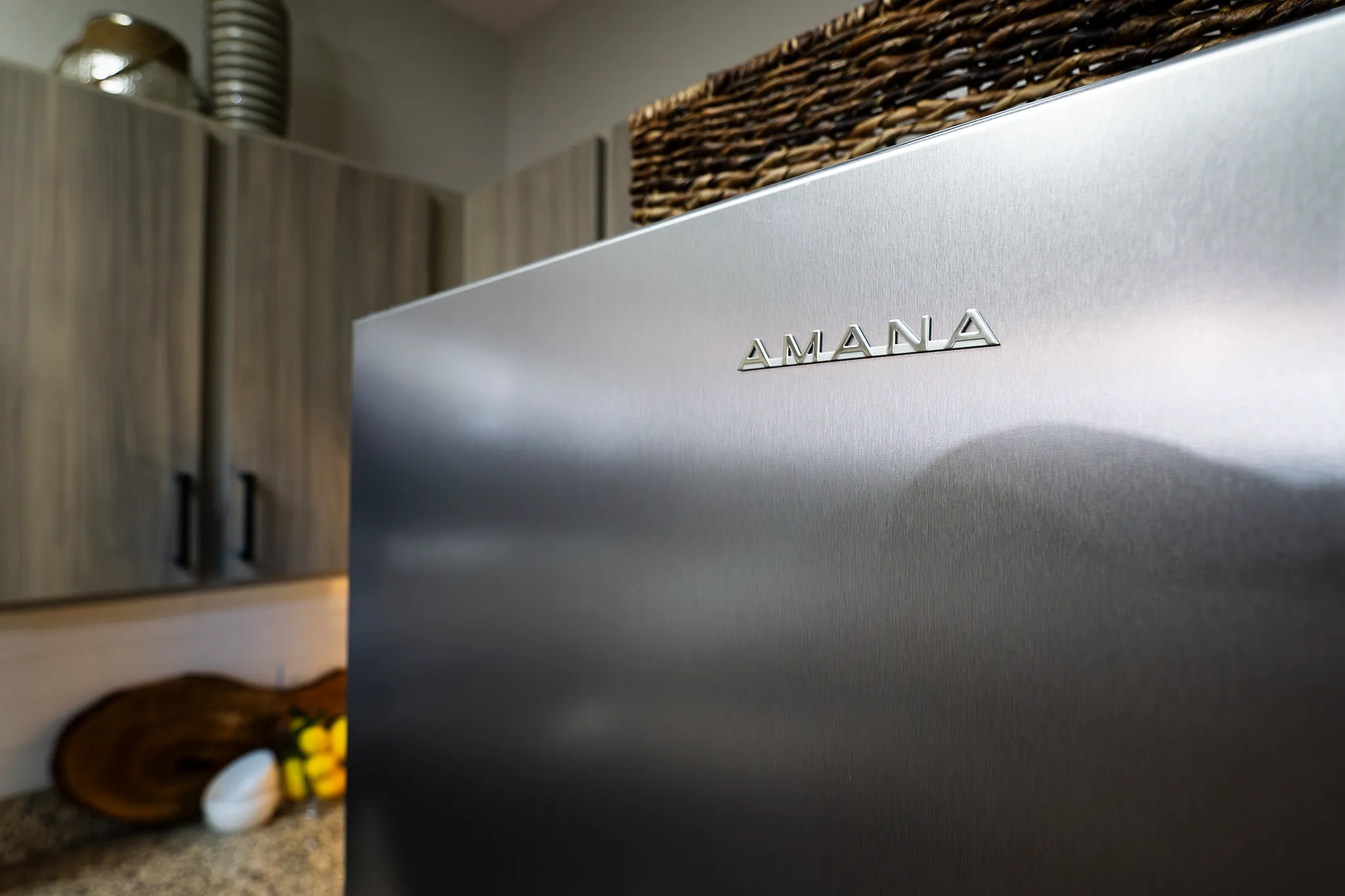 Upscale stainless steel Amana refrigerator in a newly renovated kitchen in Plainfield, IL.