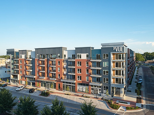 Modern apartment complex showcasing sleek architecture and ample balconies, perfect for contemporary living.