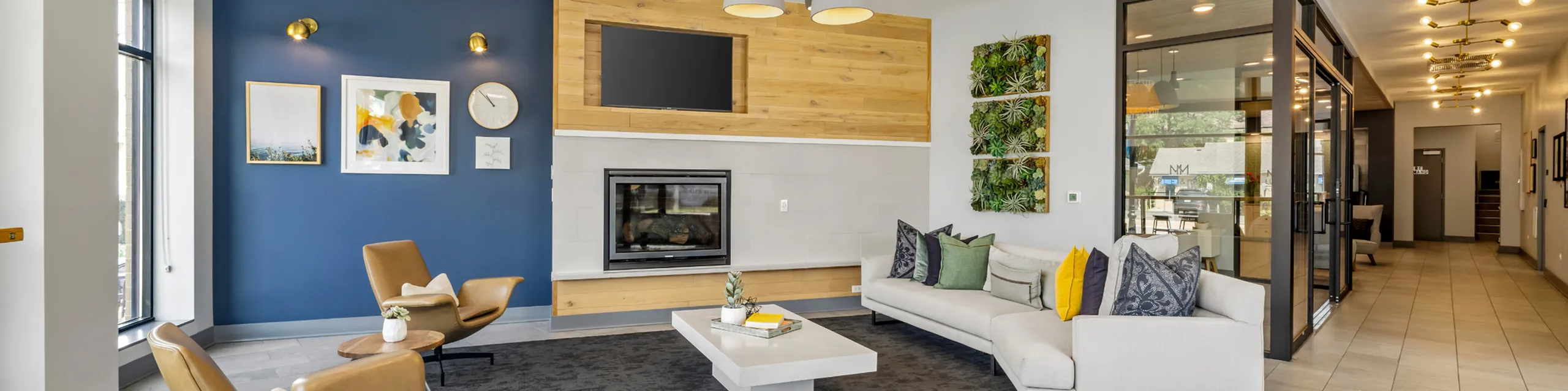 Modern apartment living room with stylish decor, comfortable seating, and a cozy fireplace, perfect for relaxation and entertaining.