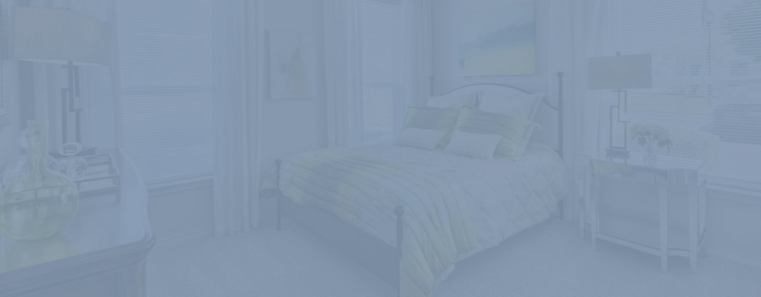Bright and inviting bedroom with a cozy bed, elegant decor, and large windows offering abundant natural light.