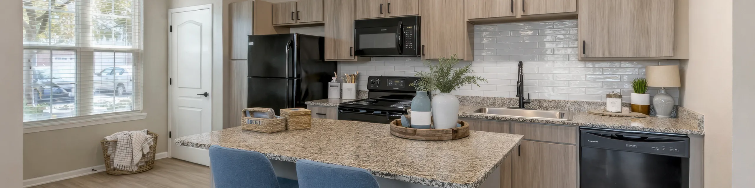 Modern kitchen with sleek countertops, stylish cabinetry, and abundant natural light.