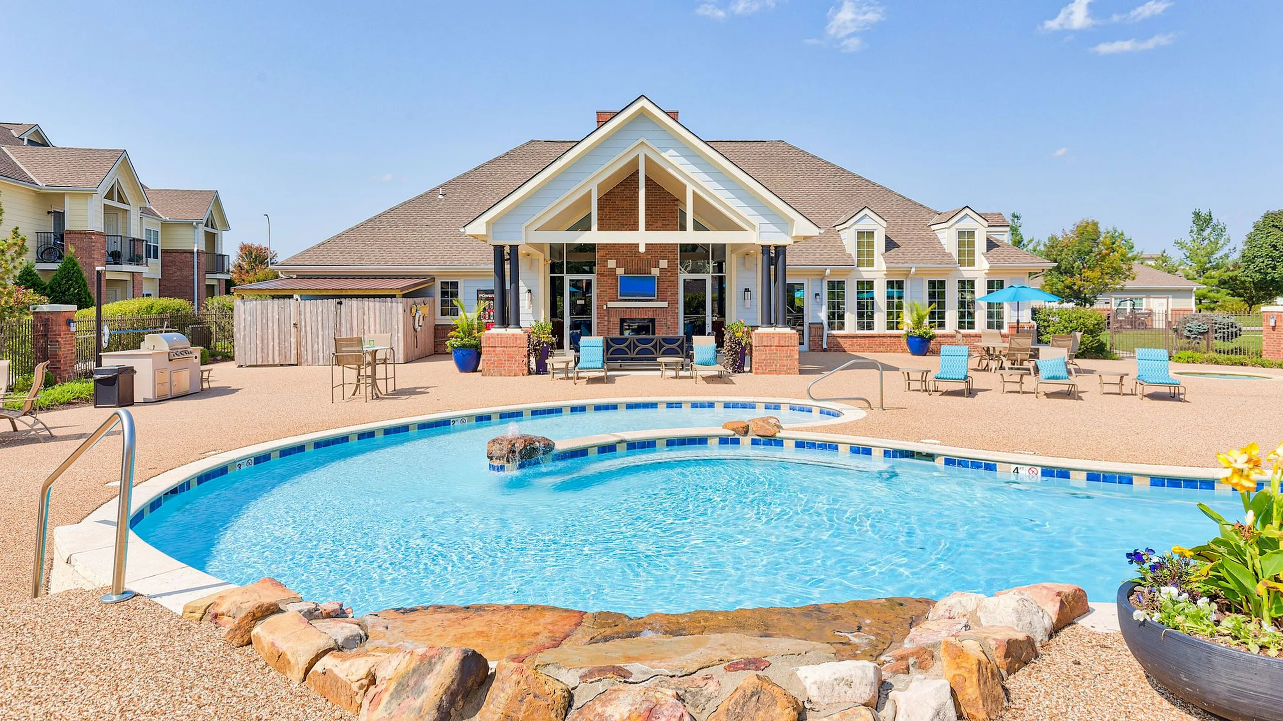 Charming residential community with a sparkling pool, manicured landscaping, and welcoming clubhouse for relaxed living.
