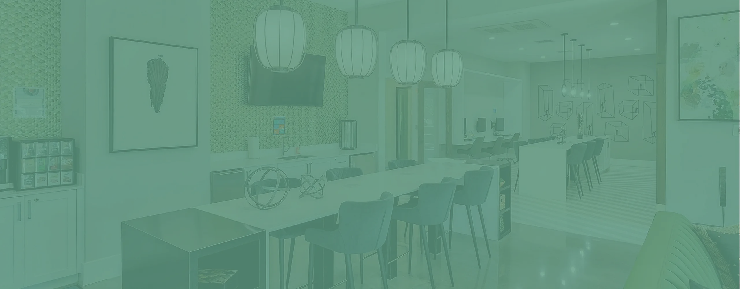 Modern communal space featuring chic lighting, comfortable seating, and a stylish coffee station, perfect for social gatherings.