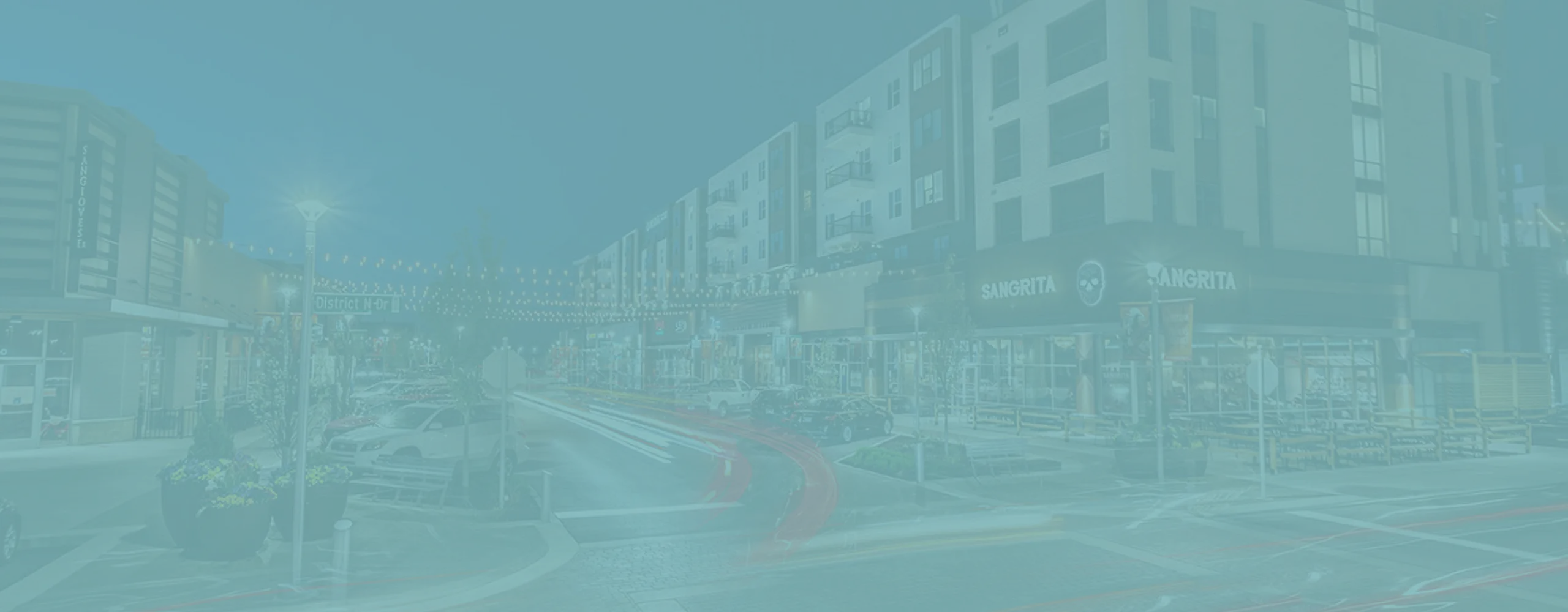 Vibrant urban scene featuring modern apartment buildings with lively street views, showcasing bustling nightlife and charming string lights.
