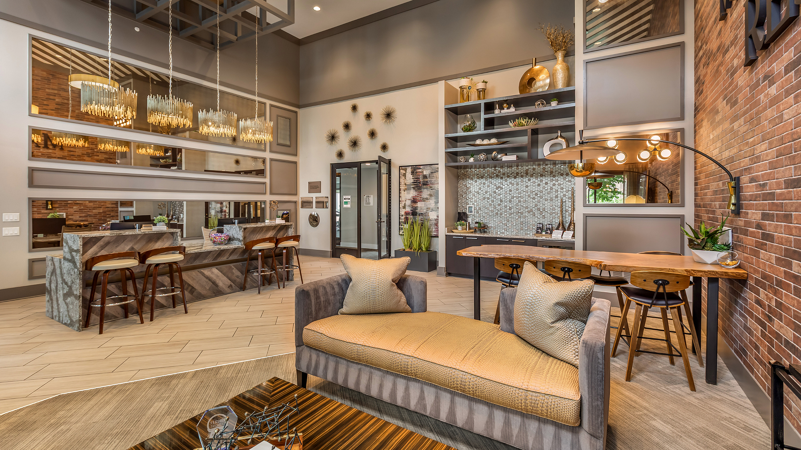 Chic lobby with elegant lounge seating, modern bar area, and warm ambient lighting, ideal for relaxation and socializing.