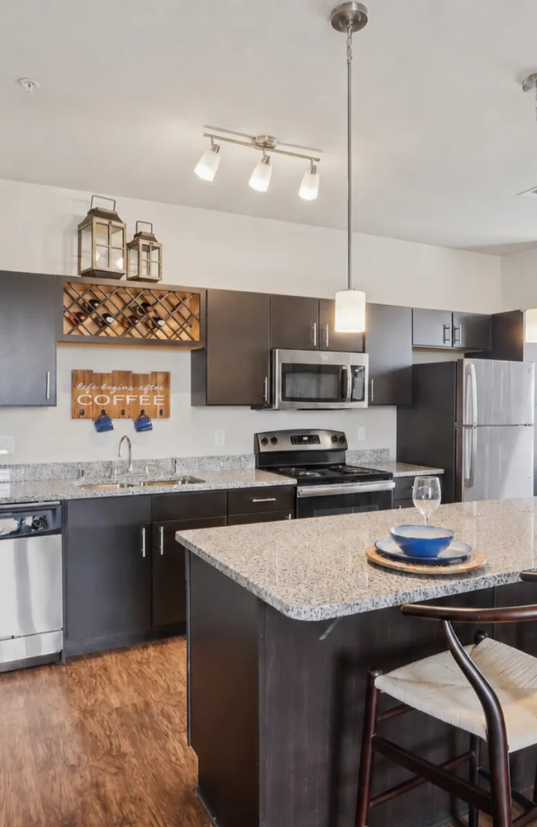 Elegant open-concept living space with modern furnishings, large windows, and stylish decor, ideal for entertaining.