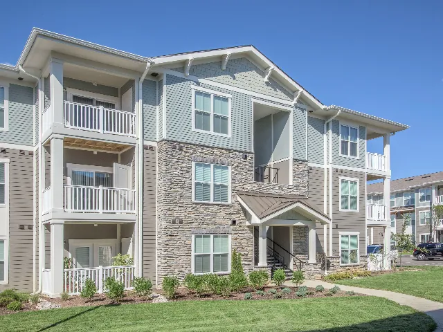 3 story building exterior with balconies.