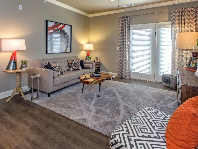 Living room with double, windowed doors to the patio.