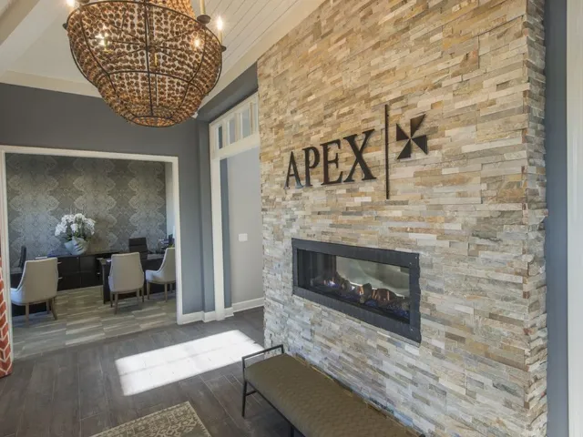 Clubhouse entrance interior, showing fireplace and leasing desks to the left.