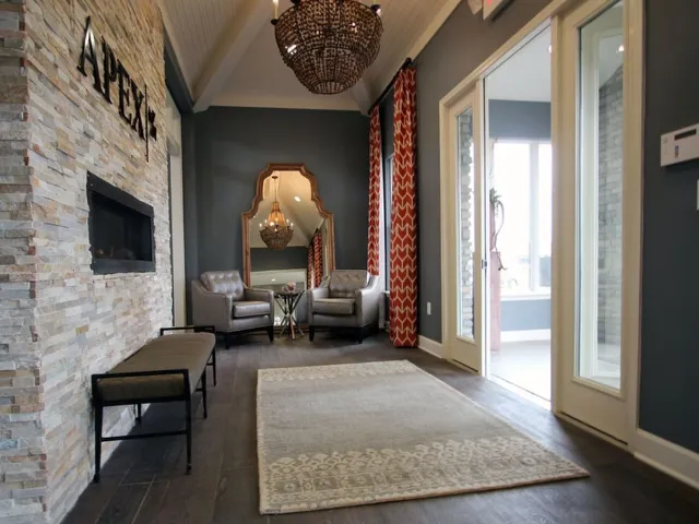 Leasing office entrance showing fireplace to the left, entrance on the right, and seating directly ahead.