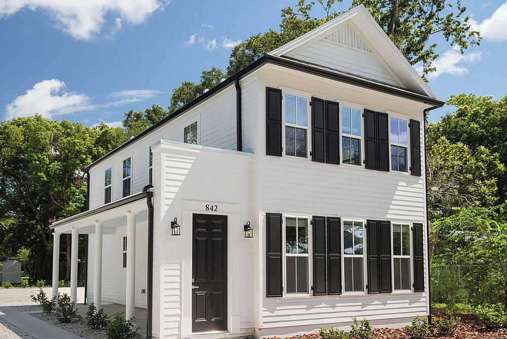 White two-story student home with black shutters at Old Row at Eastwood near UF Gainesville
