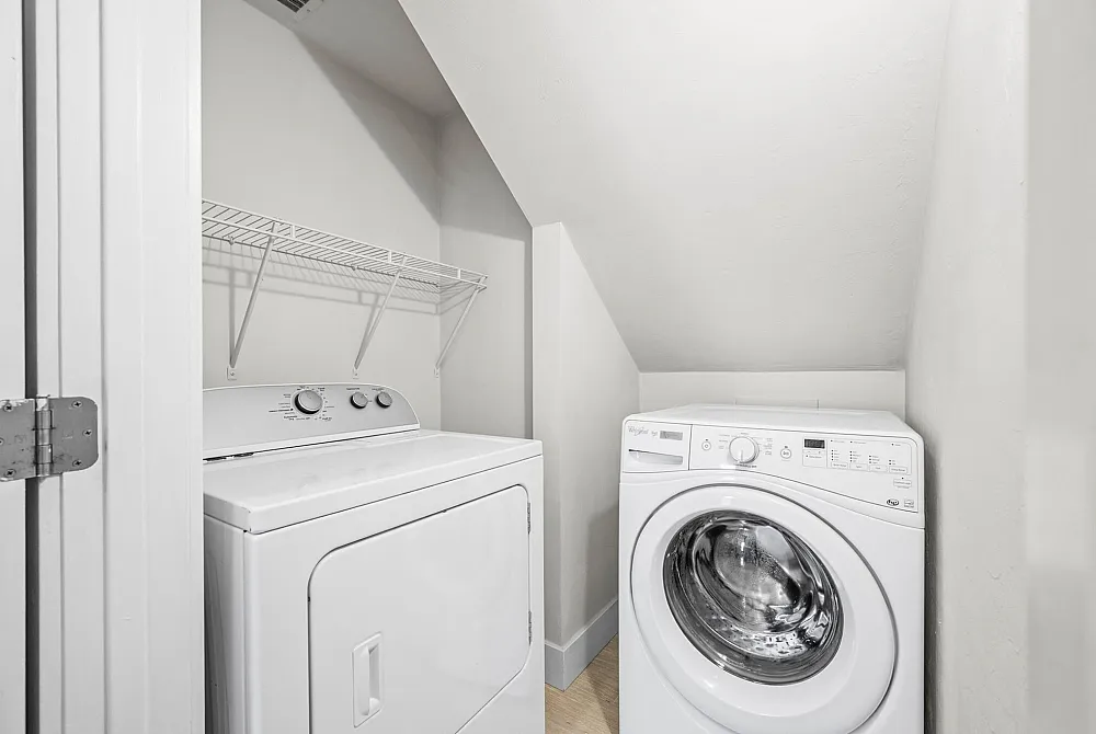 Modern laundry nook with a sleek washer and dryer, perfect for efficient home living.