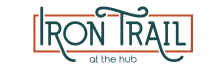 Elegant Iron Trail logo with artistic typography and stylish embellishments, perfect for modern living spaces.