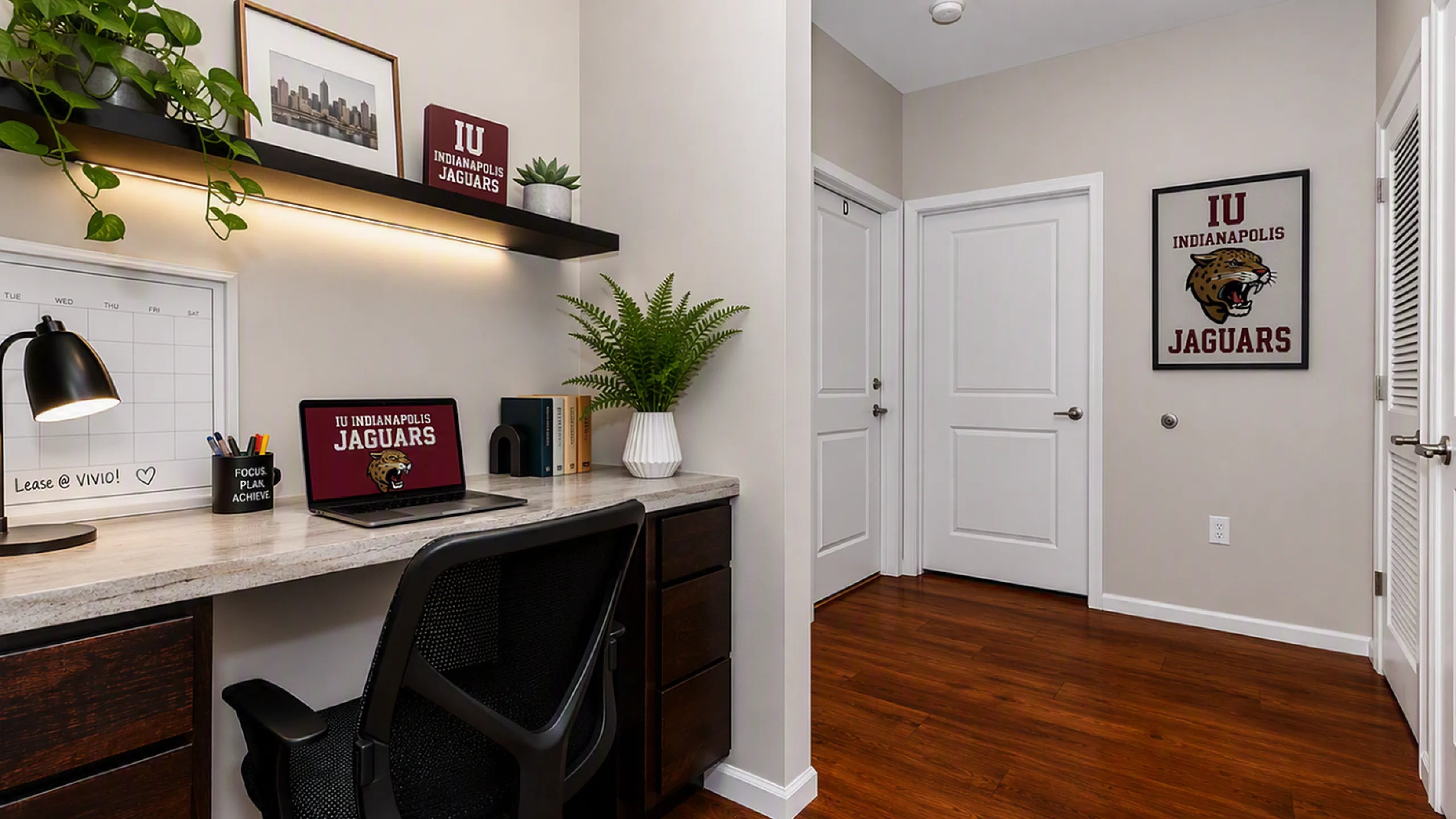 Chic home office corner with stylish shelving, modern decor, and a sleek workspace on polished hardwood floors.