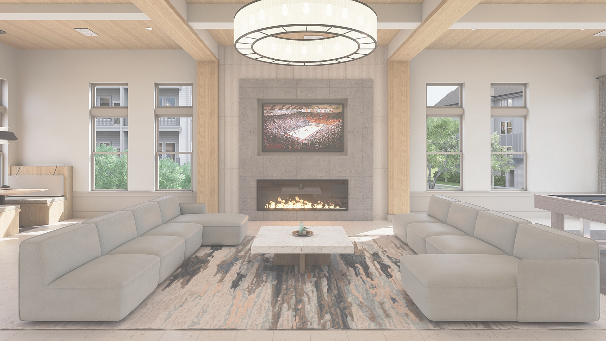 Elegant living room with plush sofas, a cozy fireplace, and a modern chandelier, offering a stylish and comfortable ambiance.