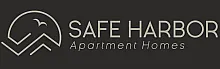 Elegant Safe Harbor Apartment Homes logo with a minimalist bird and mountain design on a sleek dark background.
